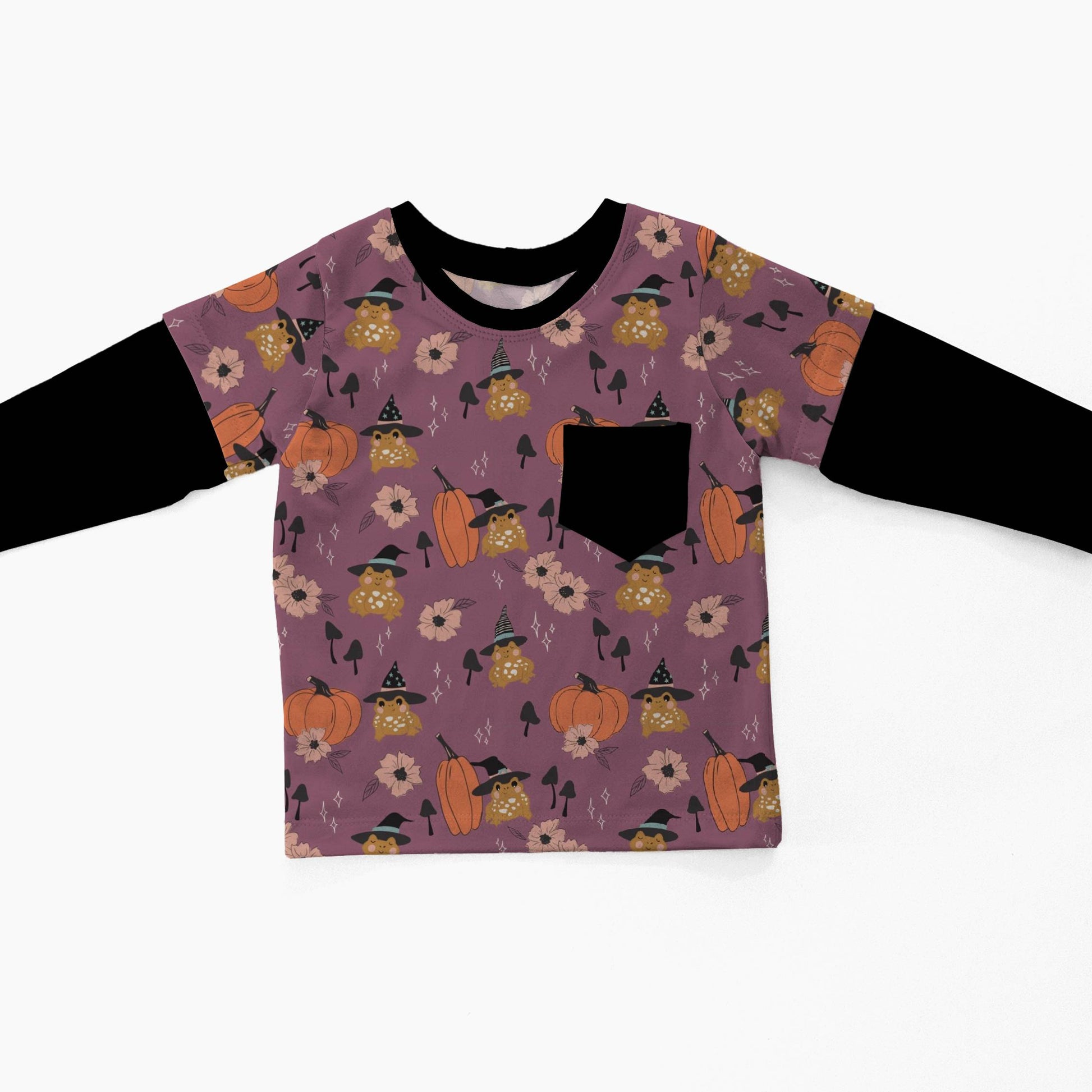 A toddler's long-sleeve shirt with a purple and orange Halloween pattern on the front and solid black sleeves, displayed flat against a white background.