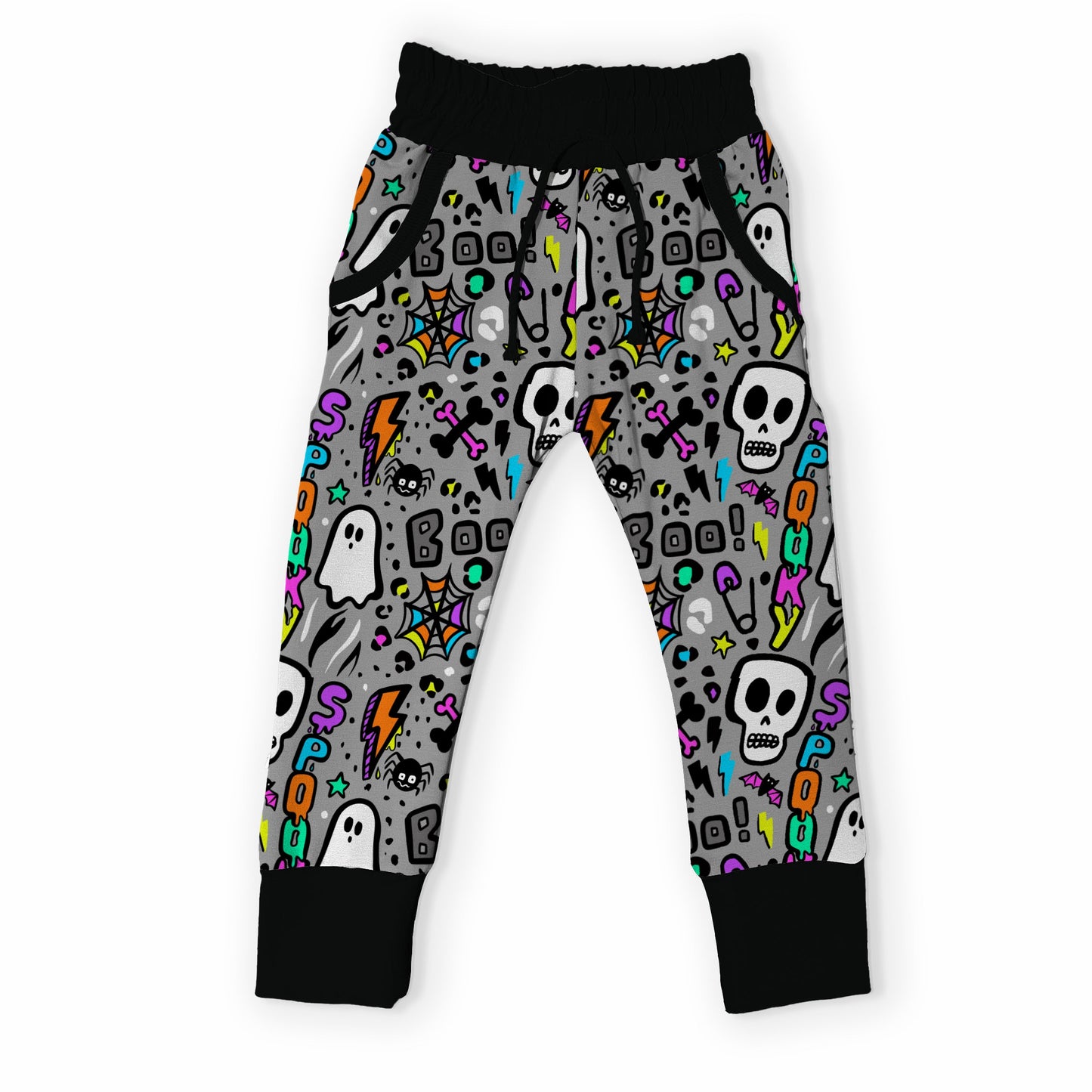 Gray kids' jogger pants with a colorful Halloween pattern of skulls, ghosts, and lightning bolts, featuring black ribbed cuffs and waistband.