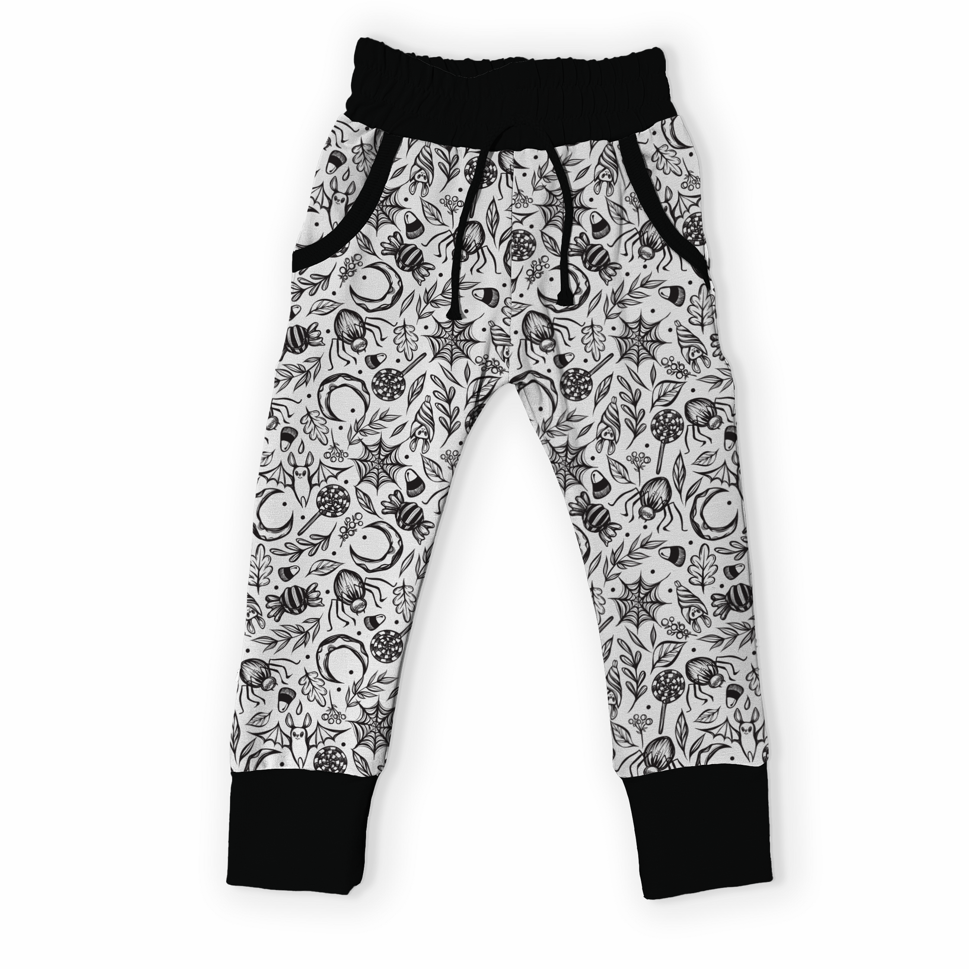 Black and white patterned pants with spiders, webs, bats on it, black cuffs on a white background.