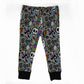 Gray children's jogger pants with a colorful Halloween pattern featuring skulls, ghosts, spiders, and 'Boo!' text, finished with black ribbed cuffs.