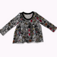 Long-sleeve peplum top, grey with spooky designs on it : pumpkins, skulls, pentagrams, coffins, ghosts