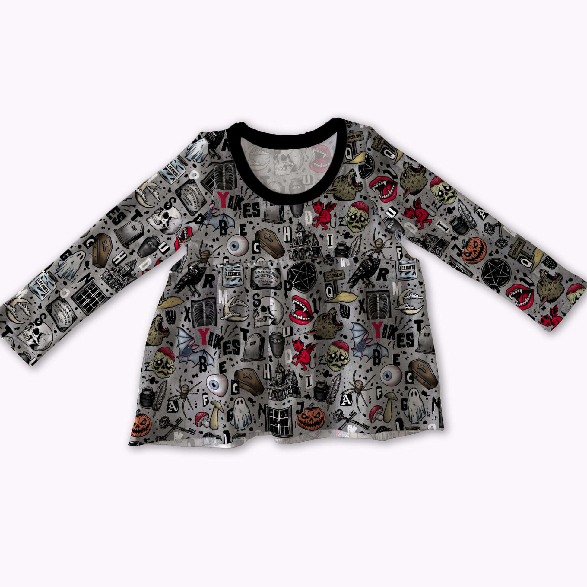 Long-sleeve peplum top, grey with spooky designs on it : pumpkins, skulls, pentagrams, coffins, ghosts