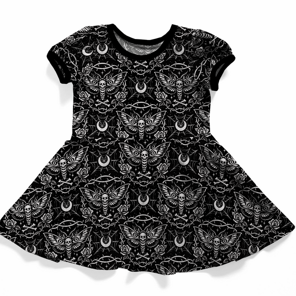 Goh baby, toddler or youth dress, short sleeves, black with white pattern. 
The print features dead head moth, moons, spiderwebs, roses and bones. 