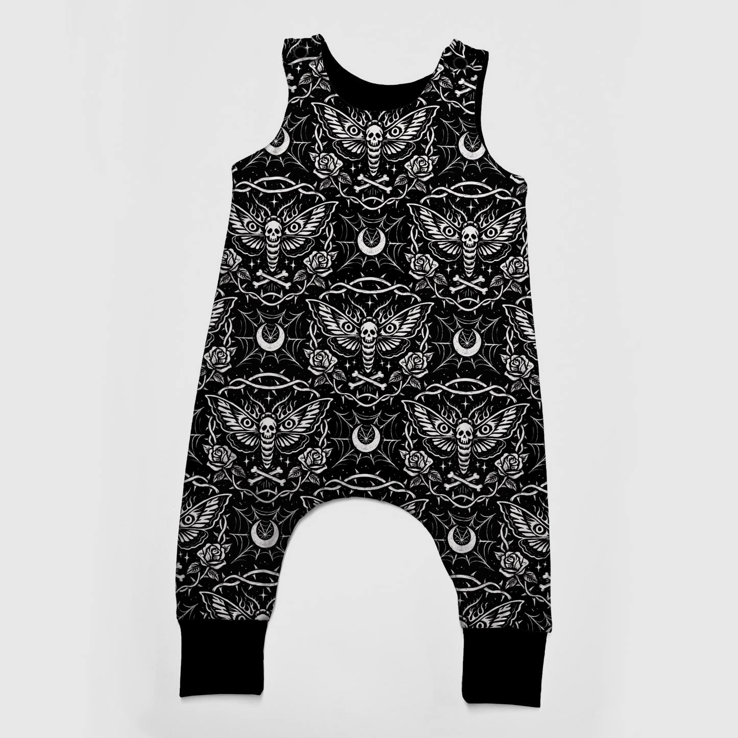 Gothic baby romper, black, with white designs : moths, spiderwebs, moons, roses and bones. 
Handmade by My Spooky Baby