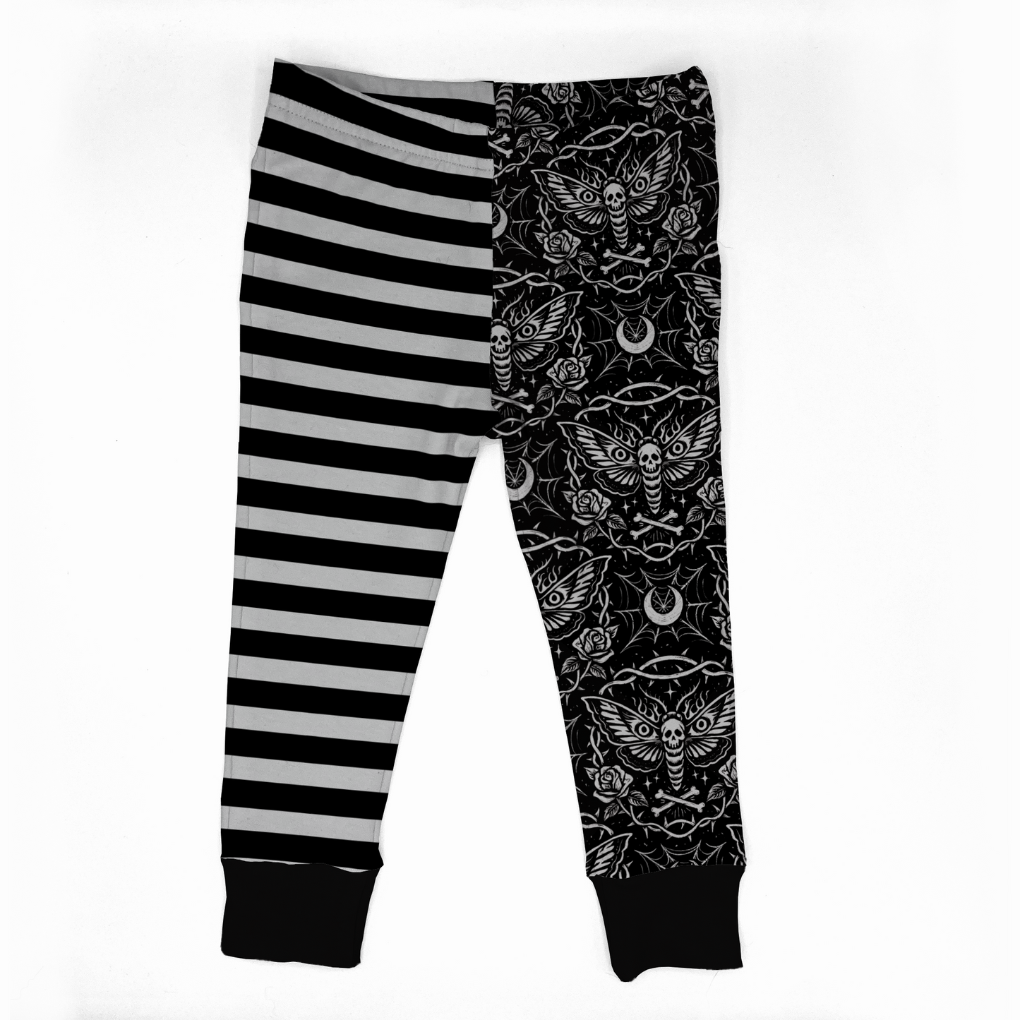 Goth baby leggings : one leg black and white striped the other black  with dead head moths bones and spiderwebs, handmade by my spooky baby. 